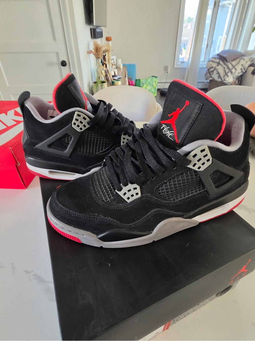 Nike Black and Red Air Jordan cement 4s